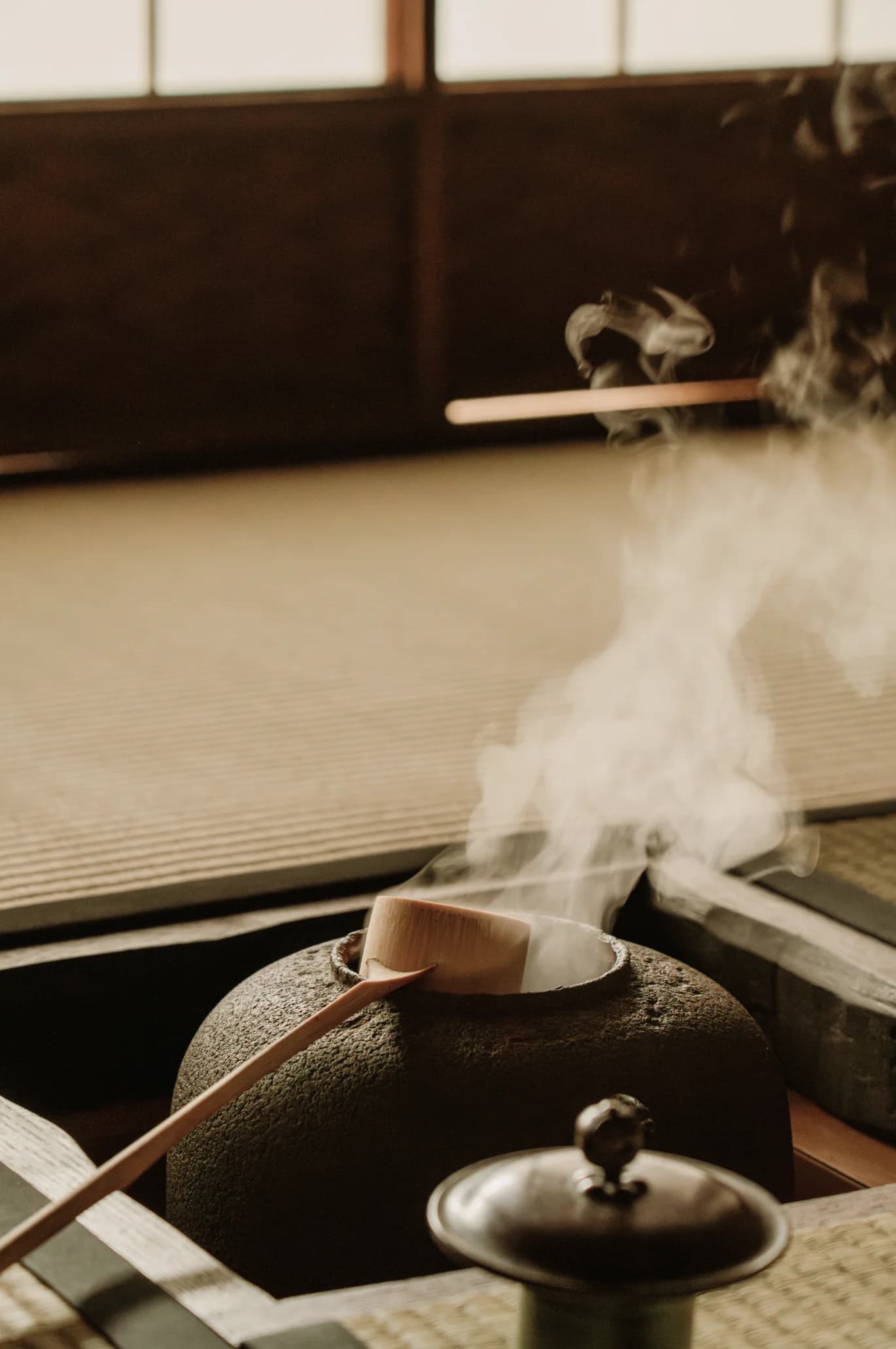 Tea ladle on a hot kettle in a traditional Japanese tea room