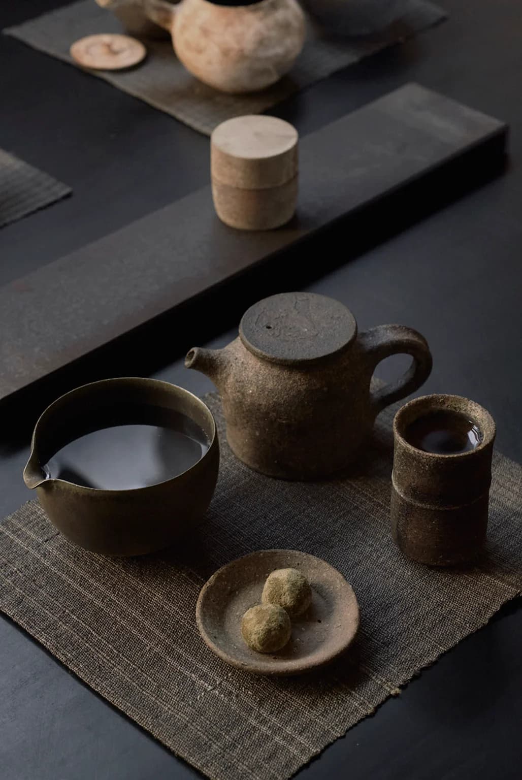 Close-up of tea being prepared in traditional vessel