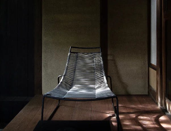 A lounge chair at Maana Kyoto